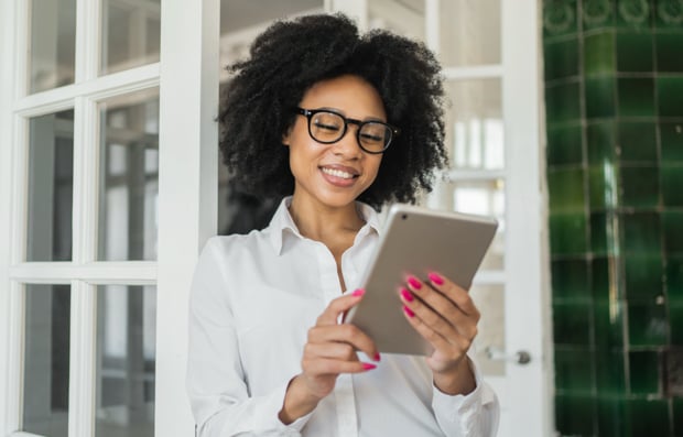 Individual looking at tablet.