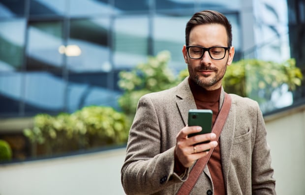 Individual looking at a cellphone.