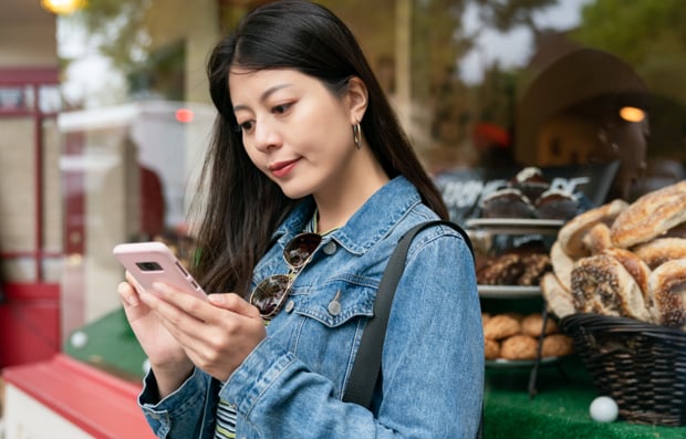 Individual looking at a cellphone.