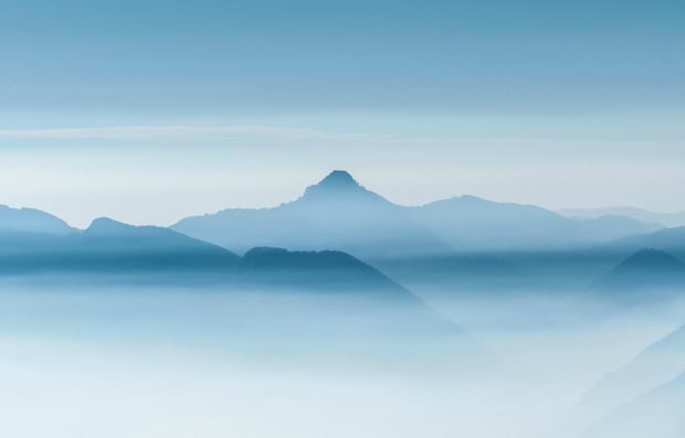 View of overlapping mountains in the distance.