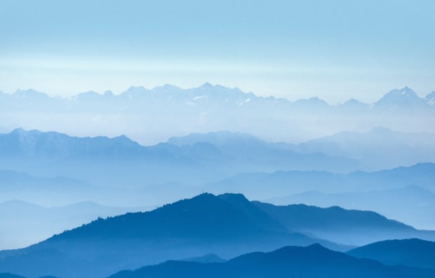 View of overlapping mountains in the distance.