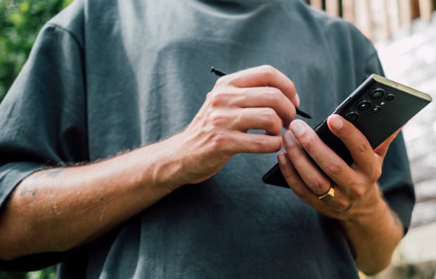 Individual looking at a cellphone.