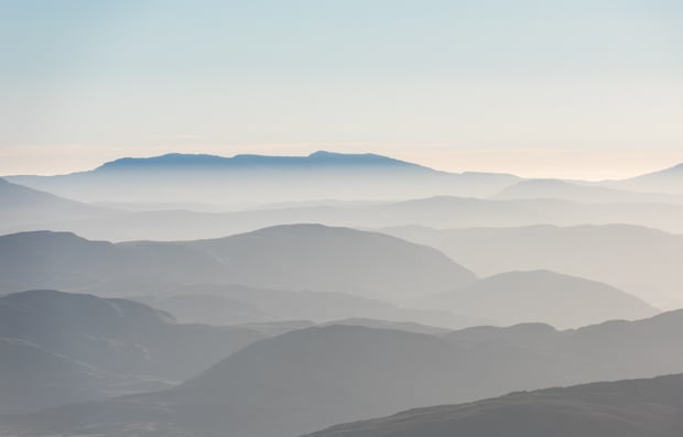 View of overlapping mountains in the distance.