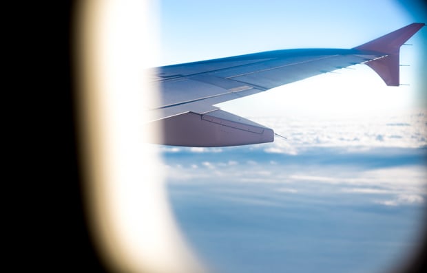 View of blue sky outside of an airplane window.