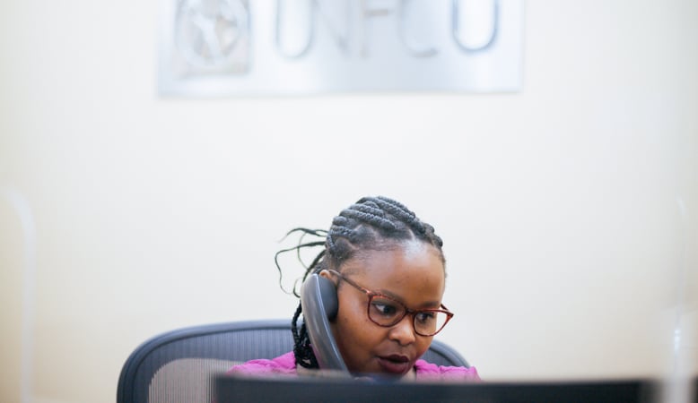 UNFCU staff member answering a phone call.