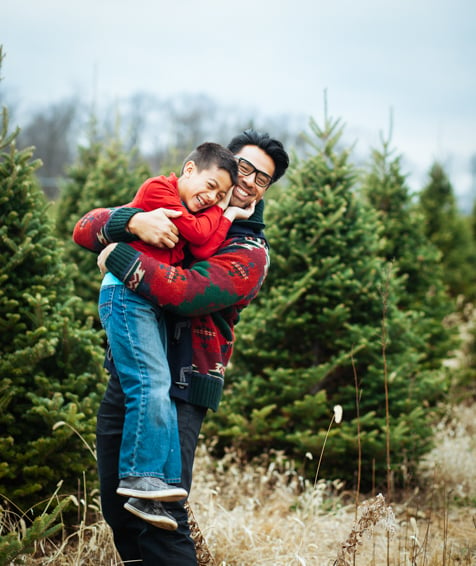 Individual hugging their child.