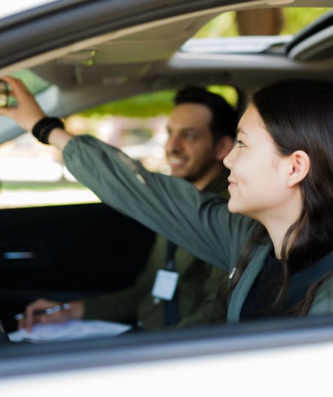 Individual preparing to drive a car.