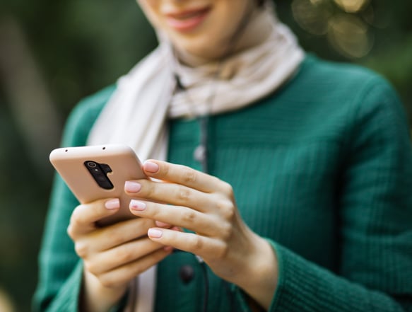 Individual looking at cellphone.