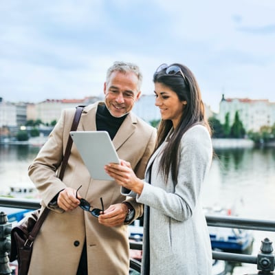 Two individuals looking at cellphone.