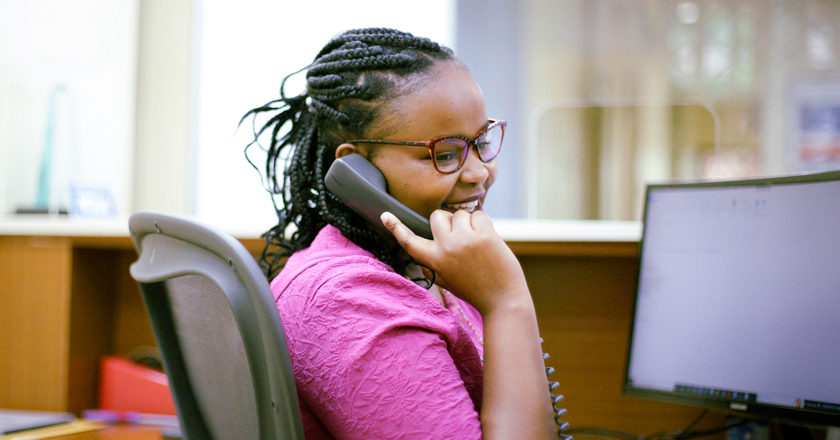 UNFCU employee answering a phone call.