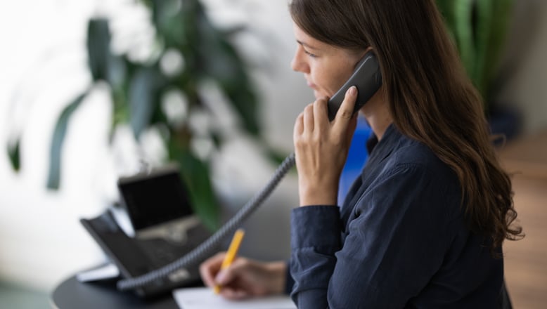 UNFCU staff member answering a phone call.