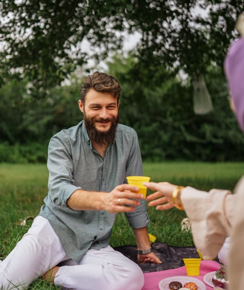 Two individuals enjoying a picnic.