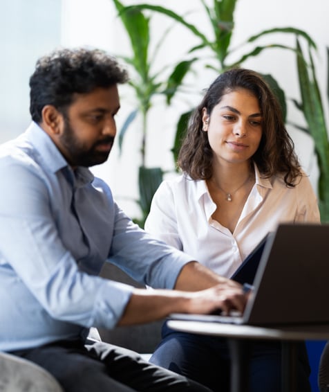 Two UNFCU employees collaborating.