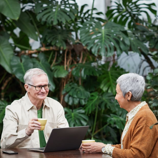 Two individuals having coffee.